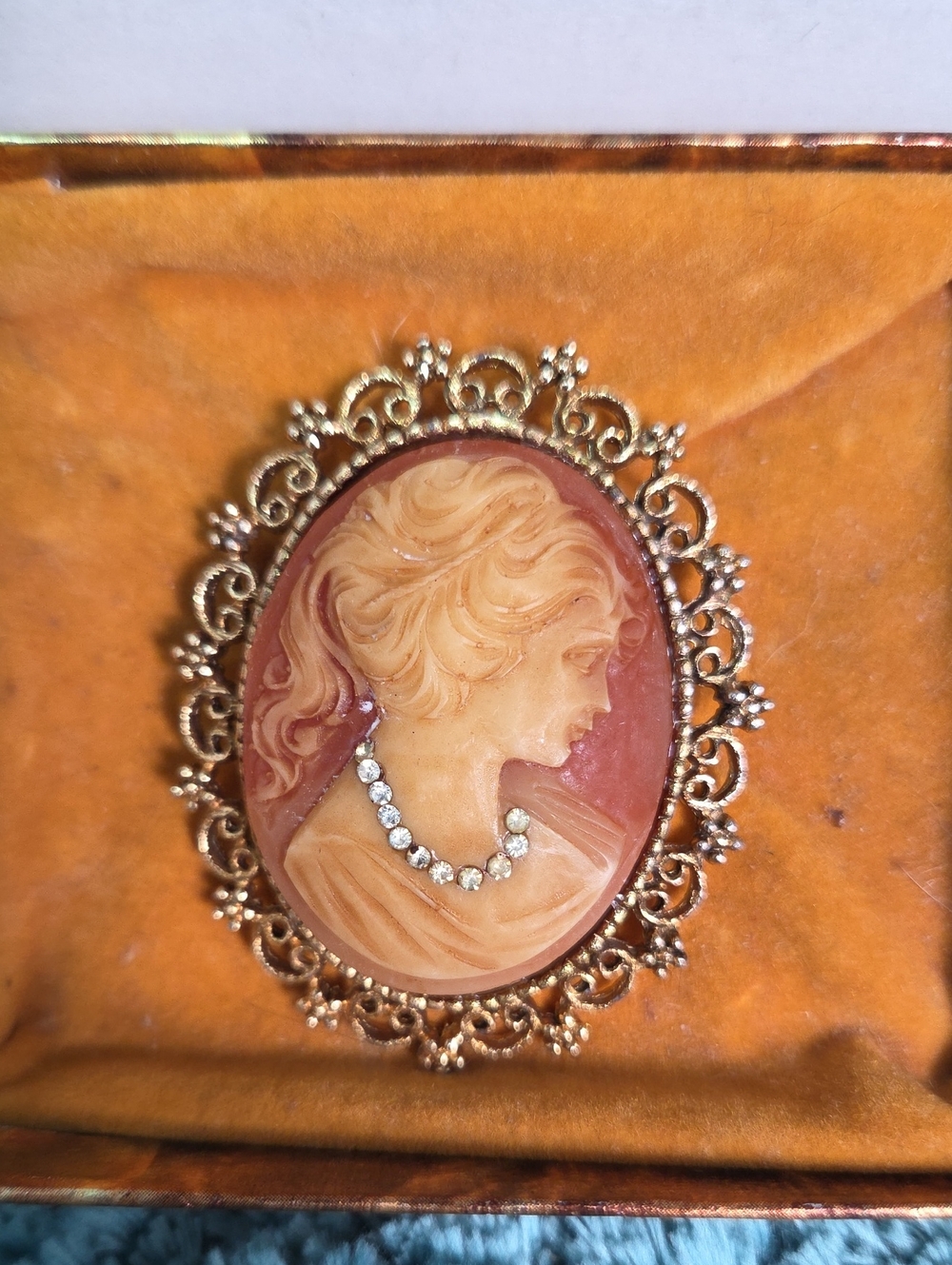 Vintage Carved Cameo Brooch in Gold with Pink and Cream Tones And Clear Stones